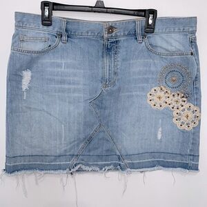 Old Navy’s Jeans ultra low waist stonewashed boho distressed frayed mini skirt.